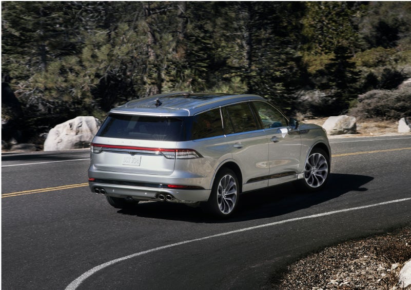 A Lincoln Aviator® is being driven on a winding road | Seekins Lincoln in Fairbanks AK