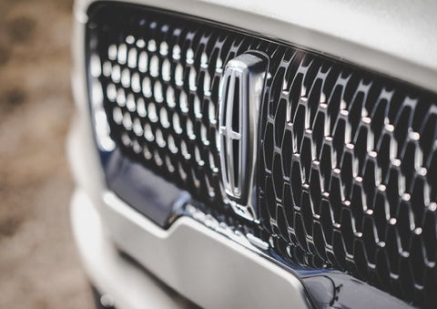 The grille of the 2024 Lincoln Aviator® Reserve model with an eye-catching repeated field of Lincoln Star logo shapes | Seekins Lincoln in Fairbanks AK