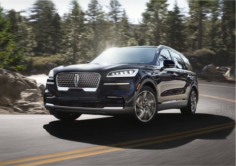 A Lincoln Aviator® SUV is being driven on a winding mountain road | Seekins Lincoln in Fairbanks AK