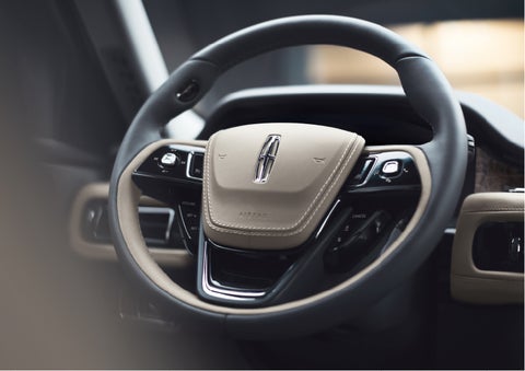 The intuitively placed controls of the steering wheel on a 2023 Lincoln Aviator® SUV | Seekins Lincoln in Fairbanks AK