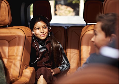 Two young people are comfortably seated in the second and third rows of a Lincoln Aviator® SUV | Seekins Lincoln in Fairbanks AK