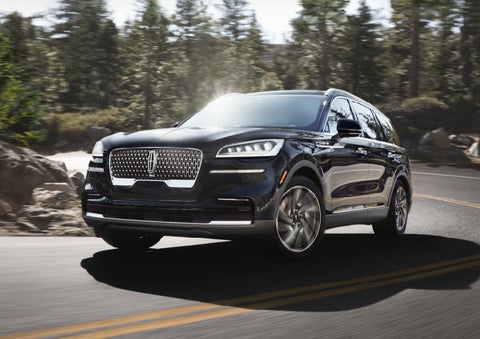 A Lincoln Aviator® SUV is being driven on a winding mountain road | Seekins Lincoln in Fairbanks AK
