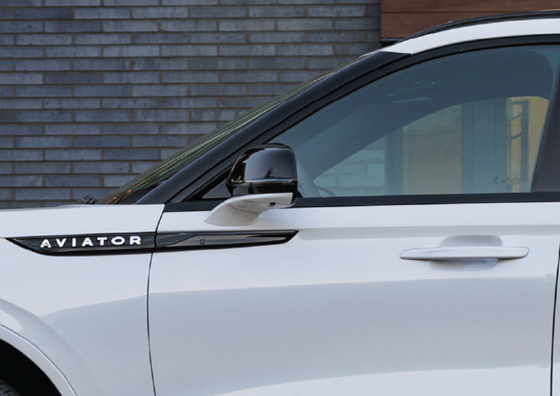The driver’s door of a white 2025 Lincoln Aviator® SUV is showcased. | Seekins Lincoln in Fairbanks AK