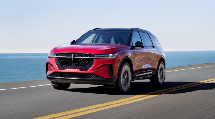 A 2025 Lincoln Nautilus® SUV is being driven on a seaside roadway. | Seekins Lincoln in Fairbanks AK