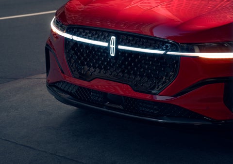 The available front LED light bar and center Lincoln Star logo glow at dusk. | Seekins Lincoln in Fairbanks AK