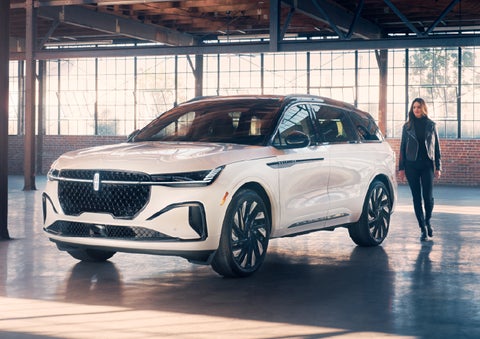 A person approaches a 2025 Lincoln Nautilus® SUV. | Seekins Lincoln in Fairbanks AK