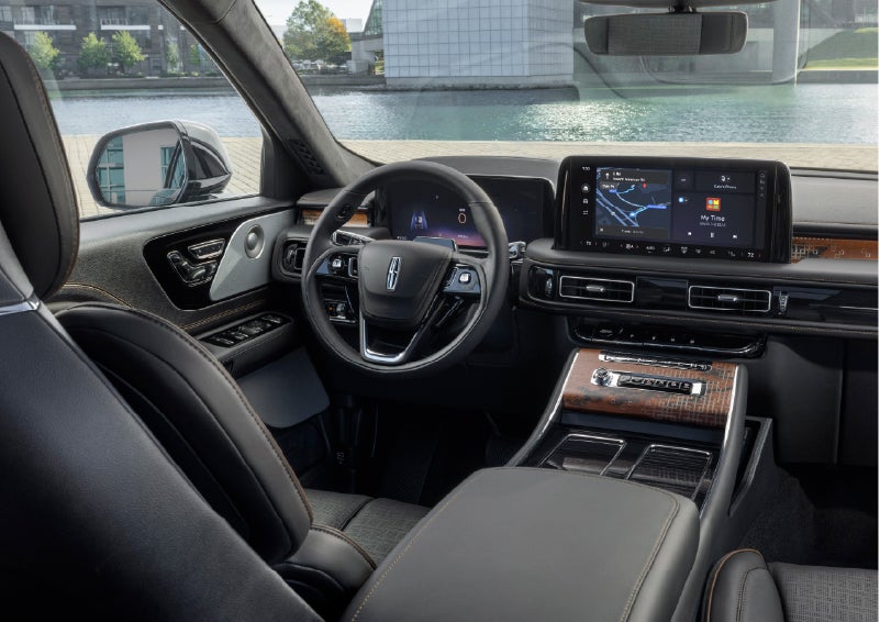The interior of the 2026 Lincoln Aviator® SUV is shown parked with a view of a harbor through the windshield. | Seekins Lincoln in Fairbanks AK