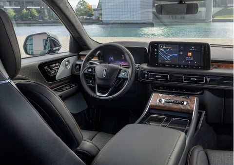 The interior of the 2026 Lincoln Aviator® SUV is shown parked with a view of a harbor through the windshield. | Seekins Lincoln in Fairbanks AK