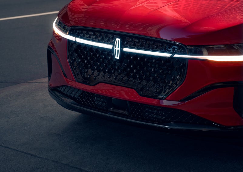 The available front LED light bar and center Lincoln Star logo glow at dusk. | Seekins Lincoln in Fairbanks AK