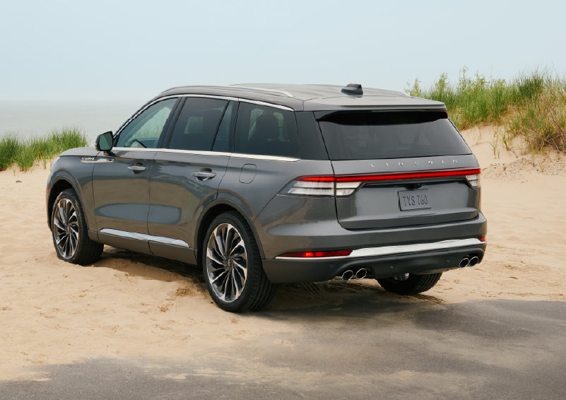 A 2027 Lincoln Aviator® SUV is parked next to sand dunes. | Seekins Lincoln in Fairbanks AK