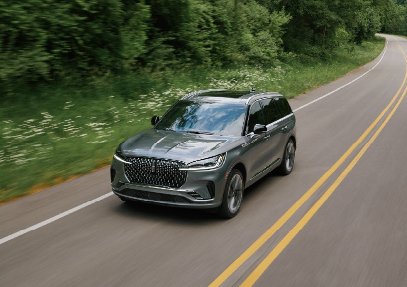 A 2027 Lincoln Aviator® SUV is being driven down a road. | Seekins Lincoln in Fairbanks AK