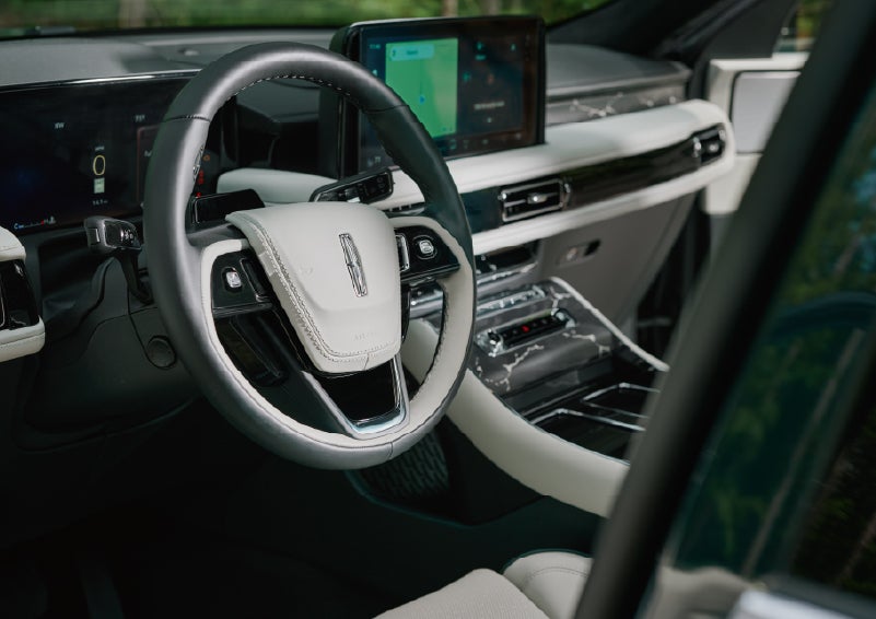 The leather-trimmed steering wheel of a 2027 Lincoln Aviator® Black Label™ SUV. | Seekins Lincoln in Fairbanks AK