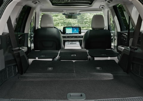 A rear to front view of the interior of a 2027 Lincoln Aviator® Black Label™ SUV shows the third and second rows folded flat | Seekins Lincoln in Fairbanks AK